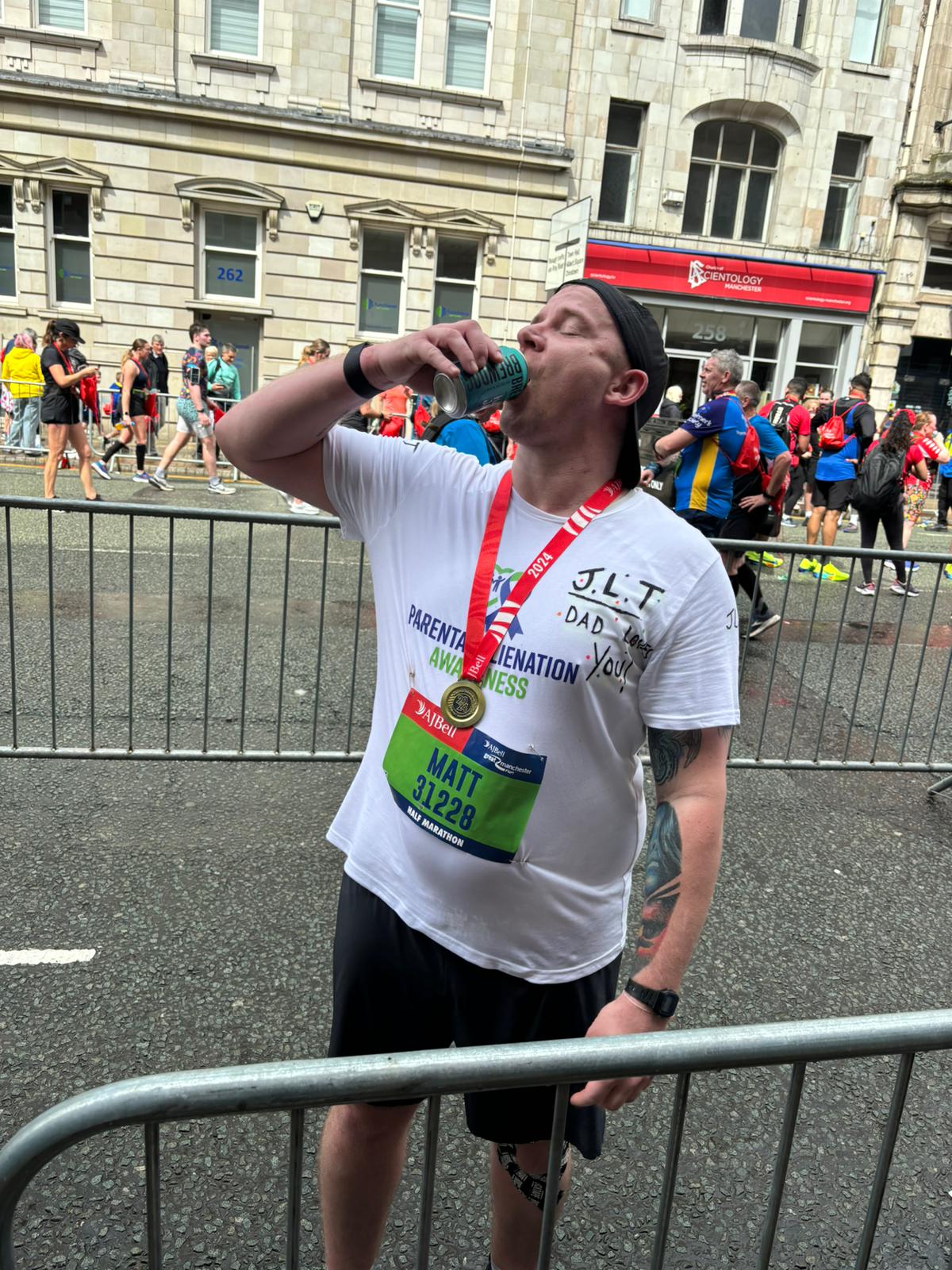 Matt Fitton at the Manchester Half Marathon finish, raising awareness for parental alienation